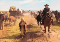  ?? COURTESY OF UNIVERSAL PICTURES ?? Tom Hanks, right, in a scene from “News of the World.” The project filmed in and around Santa Fe for 53 days.