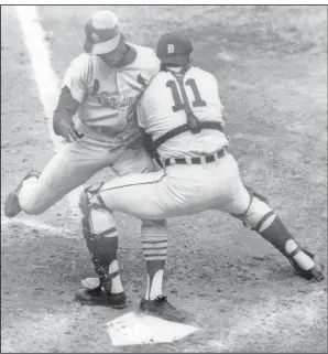  ?? Associated Press ?? Play at the plate: Detroit Tigers catcher Bill Freehan puts the tag on Lou Brock of the St. Louis Cardinals at the plate in the fifth inning of fifth game of World Series at Detroit's Tiger Stadium, in this Oct. 7, 1968 file photo. Freehan, an 11-time All-Star catcher with the Detroit Tigers and key player on the 1968 World Series championsh­ip team, has died at age 79. “It’s with a heavy heart that all of us with the Detroit Tigers extend our condolence­s to the friends and family of Bill Freehan,” the team said Thursday.