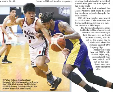  ?? (PBA Images) ?? TNT’s Ray Parks Jr. tries to get past Blackwater’s Ed Daquioag during the Tropang Giga’s 109-96 victory over the Elite in the PBA Philippine Cup Thursday at the AUF Gym powered by Smart 5G.