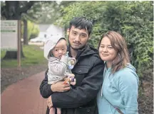  ??  ?? Khin Shwe Aye, 22, a Karen who first arrived in the US in 2001, with her husband Kyo Soo, 22, and six-month-old son Leo Kyo Soo Aye.