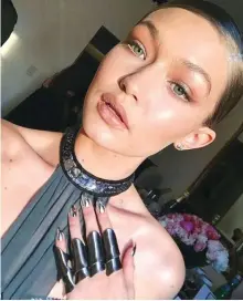  ??  ?? Gigi Hadid flaunted her $2000 ‘Chrome Nails’ manicure from KISS Nails at the Met Gala last year, setting a new style trend