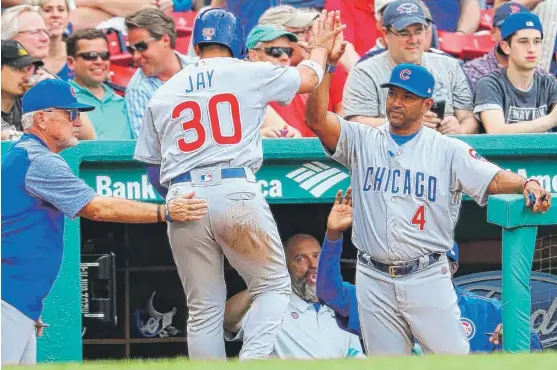  ?? | GETTY IMAGES ?? Cubs bench coach Dave Martinez ( 4) agreed to a three- year contract with the Nationals that includes an option. The deal is expected to be announced Monday.