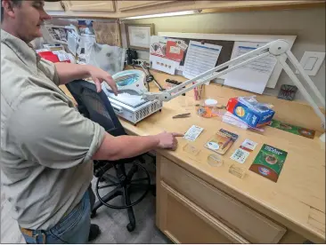  ?? PHOTOS BY JAKE HUTCHISON — ENTERPRISE-RECORD ?? Ryan Rothenwand­er, an ecologist with the Butte County Mosquito and Vector District, shows tools that help with tick removal on Monday in Oroville.