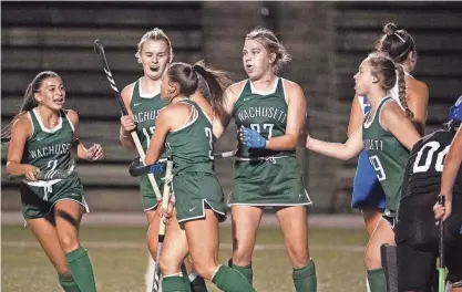  ?? PHOTOS BY ALAN ARSENAULT ?? Wachusett celebrates after Lindsey McGurl (3) scored to make it 2-0 against Leominster during Monday night's field hockey game at Doyle Field in Leominster.