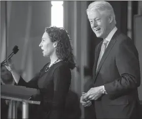  ?? Arkansas Democrat-Gazette/BENJAMIN KRAIN ?? Former President Bill Clinton introduces on Monday Catherine Finn (left), deputy editor of Harvard Medical School and HarvardX, while hosting the Clinton Foundation’s annual Health Matters Activation Summit, a yearly convening to identify strategies...