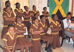  ?? PHOTOS BY CLAUDIA GARDNER ?? Students of the Little London Primary School perform a song during a peace conference in Negril last week.