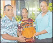  ?? Picture: ATU RASEA ?? Dux of the year Hannah Tearoko flaked by parents Trawauea Teinamaki and mum Akarina Rotan.