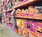  ?? GETTY IMAGES ?? Shoppers peruse the Halloween assortment at a home improvemen­t store in Alhambra, Calif.