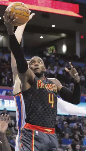  ?? —AP ?? Atlanta Hawks forward Paul Millsap helps his team eclipse the Oklahoma City Thunder.