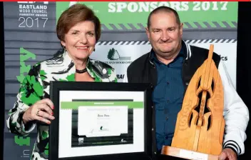  ??  ?? Social Developmen­t Minister and local MP, Anne Tolley, present Brian Deam, of Big Bark Logging, with the Eastland Wood Council Skilled Forestry Profession­al of the Year award.
The award winners are:
Training Excellence
• NZ Apprentice of the Year:...