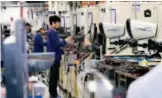  ?? IC ?? February 9, 2019: Workers on a production line at Tianjin Samsung Electro- Mechanics Co., Ltd. Samsung Group chose to build a production base for multi-layer ceramic chip capacitors in Binhai New Area, Tianjin.