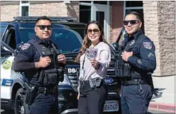  ?? PROVIDED PHOTOS ?? Delano police officers show off the patch being sold to raise money for special education.