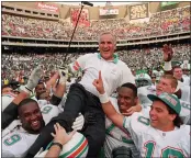  ?? AP PHOTO — GEORGE WIDMAN, FILE ?? Miami Dolphins coach Don Shula is carried on his team’s shoulders after his 325th victory, against the Philadelph­ia Eagles in Philadelph­ia.