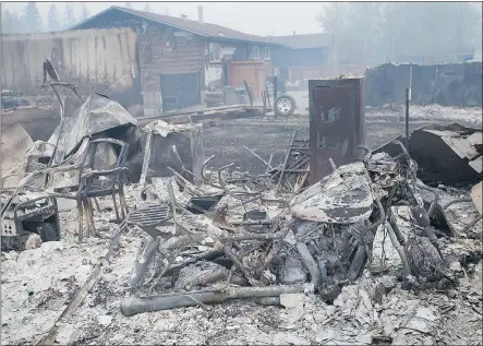  ?? — GETTY IMAGES FILES ?? Home foundation­s and skeletons of possession­s are all that remain in parts of Fort McMurray. Wildfires, which are still burning, have forced the evacuation of more than 80,000 residents.