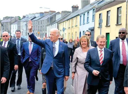  ??  ?? Back to his roots: Joe Biden, then Vice-president, with Irish Taoiseach Enda Kenny (second right), in Ballina, Mayo, June 2016