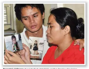  ??  ?? Parental vigilance: Nurul Nadirah Abdullah’s mother Roselyn Alan being consoled by her husband and the girl’s stepfather Lima Medeng in Johor on March 5. With the child’s brutal killing, Malaysians are once again reminded of the pressing need to...