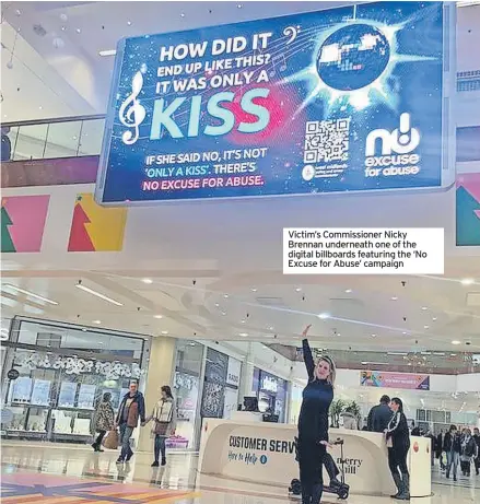 ?? ?? Victim’s Commission­er Nicky Brennan underneath one of the digital billboards featuring the ‘No Excuse for Abuse’ campaign