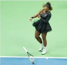  ??  ?? Serena smashes her racket while playing Naomi Osaka of Japan during their 2018 US Open women’s singles final. — AFP photo