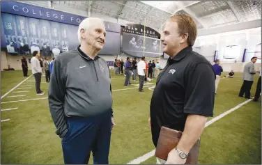  ?? Associated Press ?? Hall of Fame induction: In this March 27, 2015, file photo, Gil Brandt, left, talks with TCU head coach Gary Patterson at the team's practice facility as some players work out for scouts at NFL football pro day in Fort Worth, Texas. Brandt will be inducted into the Pro Football Hall of Fame in Canton, Ohio on Saturday.