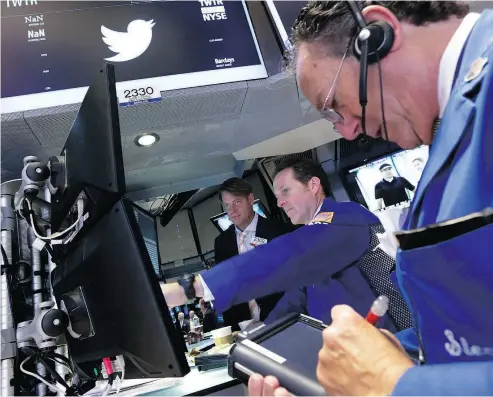  ?? THE ASSOCIATED PRESS FILES ?? The post that handles Twitter on the floor of the New York Stock Exchange. Shares of Twitter traded down 3.5 per cent in afternoon trading in New York at US$29.40 and closed at US$29.75.