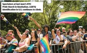  ?? ?? Spectators at last June’s NYC Pride March in Manhattan. LGBTQ identifica­tion in U.S. continues to climb.