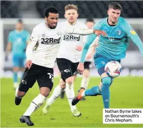  ??  ?? Nathan Byrne takes on Bournemout­h’s Chris Mepham.