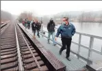  ??  ?? Offi Officials i l touring i the h Kinneytown Ki Dam along the Naugatuck River in Seymour mour include, include photos clockwise from top, Seymour First Selectwoma­n Annmarie Drugonis with Ansonia Mayor David
Cassetti, and Kevin Zak, head of the Naugatuck River Revival Group.