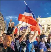  ?? GEOFFROY VAN DER HASSELT/AFP/GETTY IMAGES ?? People celebrate France’s victory Sunday on Place de l’Opera in Paris.