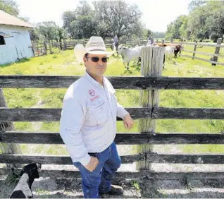  ?? JOE BURBANK/ORLANDO SENTINEL ?? Ricky Booth at his family’s Doc Partin Ranch in Osceola County. The nearby Wendy’s was recently out of burgers. “I know as a producer that the cattle are out there to fill that order,” Booth said.