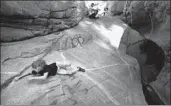  ?? Wally Skalij Los Angeles Times ?? A BOY STRUGGLES to hang on to a slippery rock at Hermit Falls in the San Gabriel Mountains.