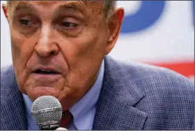  ?? (AP/Mary Altaffer) ?? Rudy Giuliani, shown speaking at a rally Monday, said on his radio show Thursday that the action against him “is happening to shut me up. They want Giuliani quiet.”