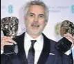  ?? AP ?? Alfonso Cuaron with Best Film and Best Director awards.