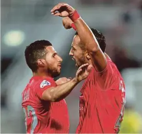  ?? AFP PIC ?? Duhail’s Medhi Benatia (right) celebrates his goal against Esteghlal on Tuesday.