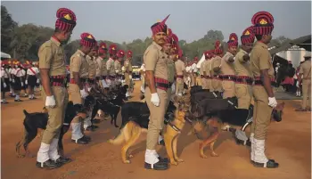  ?? GETTY IMAGES ?? The K-9 unit of the Karnataka State Police participat­es in a full dress rehearsal parade to celebrate India’s Republic Day in January in Bengaluru, home to India’s “silicon valley”.