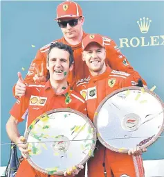  ??  ?? Ferrari’s German driver Sebastian Vettel (right) celebrates winning the Formula One Australian Grand Prix with third-placed Ferrari’s Finnish driver Kimi Raikkonen (centre) in Melbourne. — AFP photo