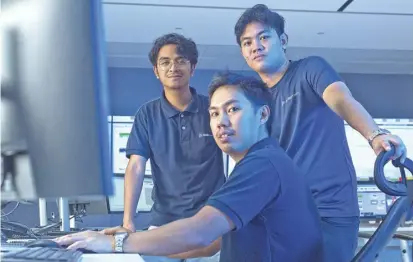  ?? ?? Hedcor control engineers (from left): Jezreel John P. Sannadan, Dwight A. Oide, and Rhyan Jason G. Delizo are some of the young profession­als recruited by AboitizPow­er to operate, monitor, and control in one location over 20 renewable energy facilities spread across the country.