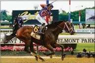  ?? Frank Franklin II / Associated Press ?? Mo Donegal and jockey Irad Ortiz Jr. cross the finish line to win the Belmont Stakes on Saturday at Belmont Park in Elmont, N.Y.