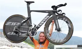  ??  ?? Annemiek van Vleuten of the Netherland­s celebrates winning gold Photograph: Matthew Childs/Reuters
at
the Fuji speedway.