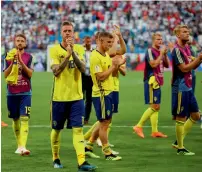  ?? AP ?? Swedish players applaud at fans after losing against England. —