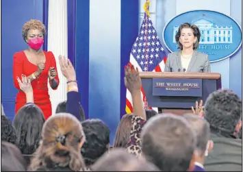  ?? Susan Walsh The Associated Press ?? White House deputy press secretary Karine Jean-pierre, left, calls on a reporter to ask Commerce Secretary Gina Raimondo a question Tuesday at the White House.