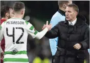  ??  ?? Brendan Rodgers congratula­tes McGregor