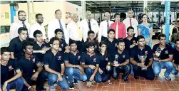  ??  ?? The Team Shark members and the Management of DIMO and DIMO Chairman Ranjith Pandithage (standing 4th from left) PIC BY PRADEEP PATHIRANA