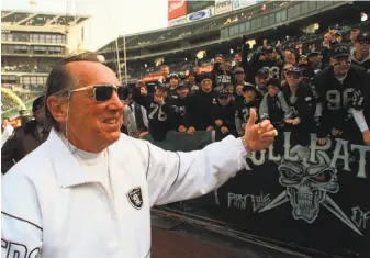  ?? Paul Sakuma / Associated Press 1998 ?? Late Raiders owner Al Davis gave a thumbs-up to fans prior to a game in 1998. Thirty-five years after Davis moved the Raiders to Los Angeles, his son decided to take them to Las Vegas.