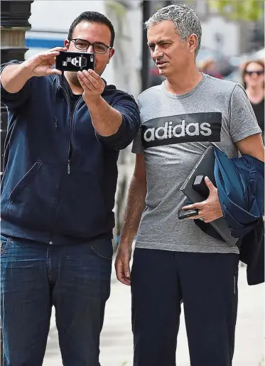  ??  ?? Special moment: Jose Mourinho posing for a selfie with a fan in London last Wednesday. — Reuters