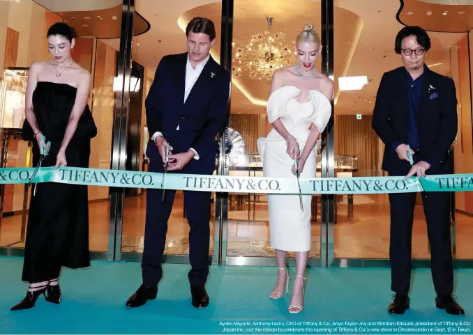  ?? ?? Ayaka Miyoshi, Anthony Ledru, CEO of Tiffany & Co., Anya Taylor-Joy and Shintaro Kitsuda, president of Tiffany & Co. Japan Inc., cut the ribbon to celebrate the opening of Tiffany & Co.'s new store in Omotesando on Sept. 12 in Tokyo.