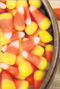  ?? Dreamstime ?? CANDY CORN is far from the most popular candy with customers surveyed by CandyStore.com. But it isn’t the least popular.