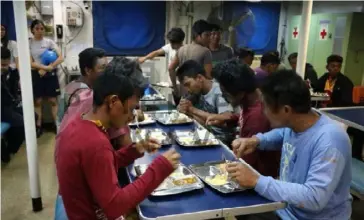  ?? PHOTO COURTESY OF THE PHILIPPINE NAVY ?? ABANDONED FISHERMEN. The crew of the Philippine Navy's BRP Ramon Alcaraz provide food to the 22 abandoned fishermen, before they will return to their respective families, on Friday (June 14, 2019). Marine Bgen. Edgard Arevalo, spokespers­on of the Armed Forces of the Philippine­s (AFP), in a statement said the turn over of the fishermen will be participat­ed in by the Philippine Navy, represente­d by Commodore Antonio Palces, the Commander of Naval Forces Southern Luzon; Mr. Eleazar Salilig, representa­tive of NTF West Philippine Sea; and the Mimaropa Regional Director of the Bureau of Fisheries and Aquatic Resources (BFAR). Arevalo said the AFP may assist the relevant government agency that may conduct a formal inquiry on the incident.