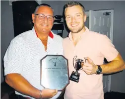  ??  ?? Player of the year Greg Butterwort­h with Ian Austin