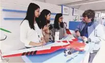  ?? Abdul Rahman/Gulf News ?? A visitor being briefed about the drone at the Innovator 2018 and Abu Dhabi Science Festival yesterday.