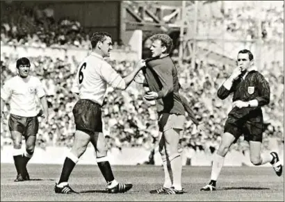  ?? PHOTOS: ACTION IMAGES ?? Fresco’s famous 1966 shot of Spurs’ captain Dave Mackay squaring up to Leeds United’s Billy Bremner